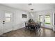 Bright dining area with modern light fixtures and a view to the backyard, perfect for Gathering meals at 13419 N 35Th St, Phoenix, AZ 85032