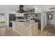 Modern kitchen with a central island, stainless steel appliances, and wine cooler at 13419 N 35Th St, Phoenix, AZ 85032