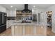 Well-equipped kitchen featuring a large island with stone countertops, stainless steel appliances, and stylish cabinetry at 13419 N 35Th St, Phoenix, AZ 85032