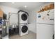 Well-lit laundry room featuring stacked washer and dryer at 13419 N 35Th St, Phoenix, AZ 85032