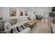 Spacious living room with dining area, featuring a comfortable sectional sofa and wood floors at 13419 N 35Th St, Phoenix, AZ 85032