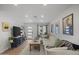 Cozy living room with a large sectional sofa, television, and stylish decor at 13419 N 35Th St, Phoenix, AZ 85032