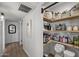 Organized pantry with wooden shelves, offering ample storage space for kitchen essentials and supplies at 13419 N 35Th St, Phoenix, AZ 85032