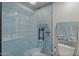 Modern shower with glass enclosure and blue subway tile at 13419 N 35Th St, Phoenix, AZ 85032