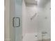 Modern bathroom shower with clear glass doors and safety bar for accessibility at 1357 S Loma Vis, Mesa, AZ 85204