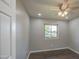 Bedroom with natural light from window, hardwood floors, and modern ceiling fan at 1357 S Loma Vis, Mesa, AZ 85204