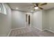 Spacious bedroom with neutral carpet, a ceiling fan, recessed lights, and an ensuite at 1357 S Loma Vis, Mesa, AZ 85204