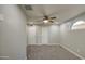 Neutral bedroom with soft carpet, ceiling fan, closet, and egress window at 1357 S Loma Vis, Mesa, AZ 85204
