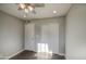Bedroom with hard wood flooring, ceiling fan and multiple storage options at 1357 S Loma Vis, Mesa, AZ 85204