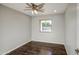 Comfortable bedroom with wood floors, modern ceiling fan, natural light from a window at 1357 S Loma Vis, Mesa, AZ 85204