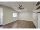 Expansive living area with wood flooring and high ceilings, offering a bright and inviting space for relaxation and activities at 1357 S Loma Vis, Mesa, AZ 85204