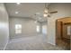 Spacious main bedroom with a ceiling fan, carpet flooring, and walk-in closet, providing comfort and ample storage at 1357 S Loma Vis, Mesa, AZ 85204