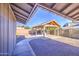 Outdoor kitchen with a built-in grill and concrete patio for entertaining, under a pavilion at 1357 S Loma Vis, Mesa, AZ 85204
