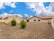 Spacious backyard featuring a detached garage and minimal landscaping at 1414 W Grovers Ave, Phoenix, AZ 85023