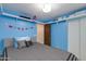Cozy bedroom with blue walls and a queen bed, accessible via a closet and hall door at 1414 W Grovers Ave, Phoenix, AZ 85023