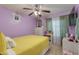Bright bedroom featuring a ceiling fan, curtains, a bed, and natural light at 1414 W Grovers Ave, Phoenix, AZ 85023