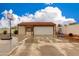 Detached two car garage with driveway and basketball hoop at 1414 W Grovers Ave, Phoenix, AZ 85023