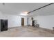Bright garage with white walls, overhead lighting, and ample storage space at 1414 W Grovers Ave, Phoenix, AZ 85023