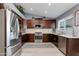 Beautiful updated kitchen with stainless steel appliances, custom cabinets, and plenty of counter space at 1414 W Grovers Ave, Phoenix, AZ 85023
