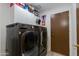 Well-equipped laundry room with modern LG washer and dryer set and storage space at 1414 W Grovers Ave, Phoenix, AZ 85023