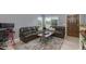 Comfortable living room featuring wood floors, neutral walls, and a modern furniture set at 1414 W Grovers Ave, Phoenix, AZ 85023