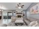 Bright living room featuring a fireplace, plush seating, and an open layout with ample natural light at 1414 W Grovers Ave, Phoenix, AZ 85023