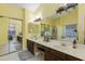 Bright bathroom featuring double sinks, spacious countertops, and a large mirror at 1414 W Grovers Ave, Phoenix, AZ 85023
