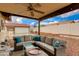 Relaxing covered patio with outdoor seating and overhead ceiling fan at 1414 W Grovers Ave, Phoenix, AZ 85023