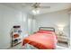 Bright bedroom featuring a ceiling fan, bedside table, and stylish bedding at 14300 W Bell Rd # 245, Surprise, AZ 85374
