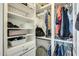 Organized closet with shelves, drawers, and hanging rods for optimal storage at 14300 W Bell Rd # 245, Surprise, AZ 85374