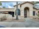 Inviting home exterior with covered patio, desert landscaping, and a welcoming entrance at 14300 W Bell Rd # 245, Surprise, AZ 85374