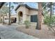 Charming single-story home with a stucco exterior, arched entryway, and low-maintenance landscaping at 14300 W Bell Rd # 245, Surprise, AZ 85374