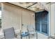 Cozy patio with seating and access to outdoor storage, shaded by a covered awning at 14300 W Bell Rd # 245, Surprise, AZ 85374