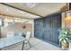 Private patio area with secure gate, table, chairs, and a covered awning at 14300 W Bell Rd # 245, Surprise, AZ 85374