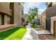 Exterior view of complex with walkway and landscaped grounds at 1432 W Emerald Ave # 648, Mesa, AZ 85202