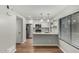 Bright kitchen featuring stainless steel appliances, white cabinets, and a marble-look countertop with pendant lighting at 1432 W Emerald Ave # 648, Mesa, AZ 85202