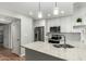 Stylish kitchen featuring white cabinetry, stainless steel appliances, and attractive granite countertops with tiled backsplash at 1432 W Emerald Ave # 648, Mesa, AZ 85202