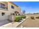 Exterior view showcasing the well-maintained facade, tiled awning and inviting landscaping of the property at 14414 N Boxwood Ln, Fountain Hills, AZ 85268