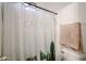 Bathroom featuring cactus shower curtain, toilet, and neutral wall paint at 14733 N 159Th Dr, Surprise, AZ 85379