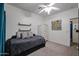 Cozy bedroom featuring a comfortable daybed, decorative shelves, and a peaceful ambiance at 14733 N 159Th Dr, Surprise, AZ 85379
