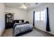 Minimalist bedroom featuring a queen bed, decorative shelving, window, and neutral carpet at 14733 N 159Th Dr, Surprise, AZ 85379