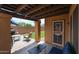 Charming covered patio with outdoor seating, offering a relaxing view of the landscaped backyard at 14733 N 159Th Dr, Surprise, AZ 85379