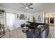Inviting living room with sectional sofa, decorative accents, open layout, and large clock on the wall at 14733 N 159Th Dr, Surprise, AZ 85379