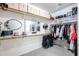 Well-organized walk-in closet featuring custom shelving, storage bins, and ample space for clothing and accessories at 14733 N 159Th Dr, Surprise, AZ 85379