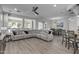 A spacious living room shows an open floor plan and stylish decor at 1556 E Vesper Trl, Queen Creek, AZ 85140