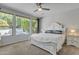 A bright main bedroom offers large windows with views of the garden at 1556 E Vesper Trl, Queen Creek, AZ 85140