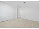 This carpeted bedroom features a closet and an open doorway for easy access at 16073 W Remuda Dr, Surprise, AZ 85387