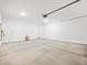 This is a large garage featuring a water heater, lighting and a garage door at 16073 W Remuda Dr, Surprise, AZ 85387