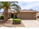Charming single-story home with a well-manicured yard, stone accents, and a tile roof at 16331 W Tierra Way, Surprise, AZ 85374