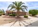 Attractive single-story home with a tile roof, well-maintained desert landscaping, and a spacious driveway at 16331 W Tierra Way, Surprise, AZ 85374
